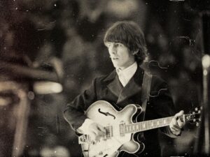Read more about the article What song did George Harrison use to learn slide guitar?